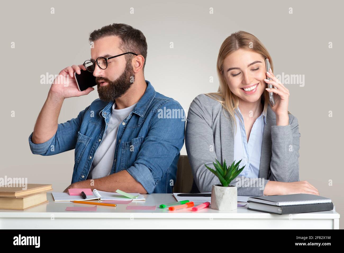 Cheating, infidelity, technology addiction and idleness at work Stock Photo