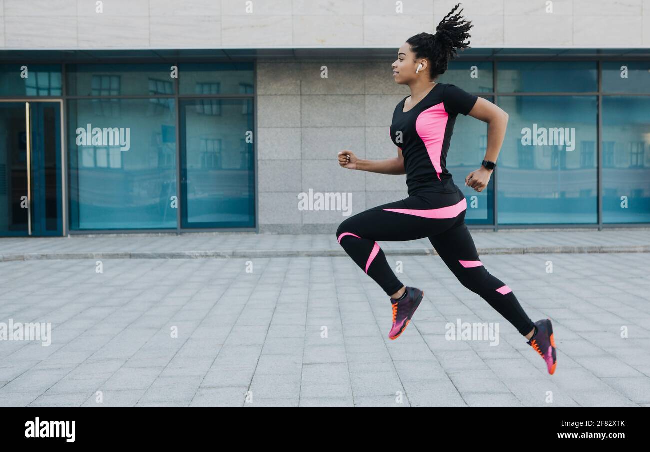Active workout with music, morning jogging and slender muscular body Stock Photo