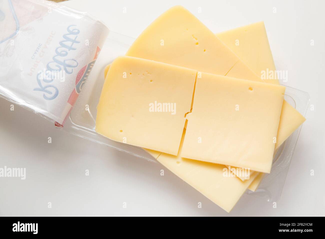 Sliced Emmi Raclette cheese bought from a supermarket in the UK. England UK GB Stock Photo