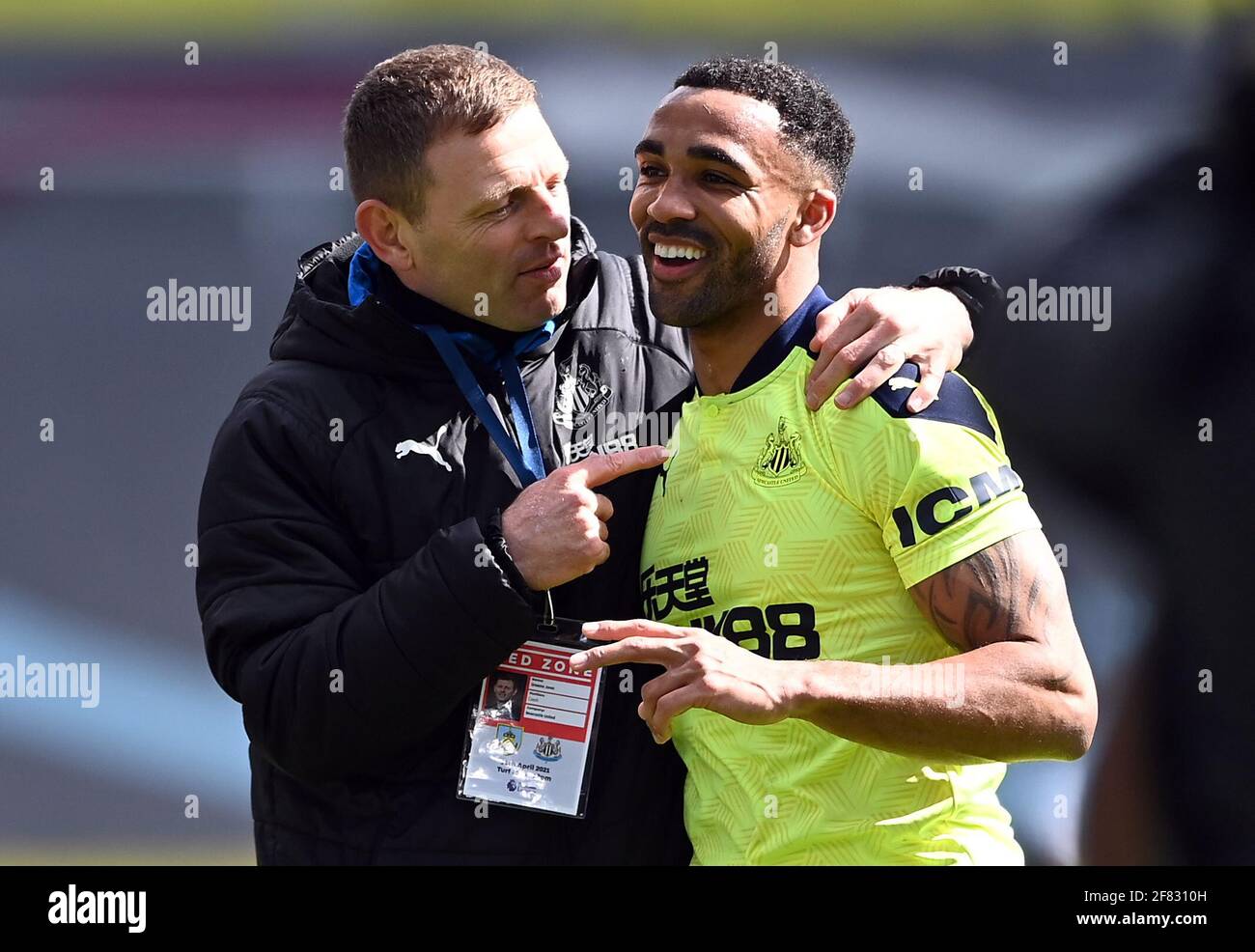 Newcastle United coach Graeme Jones and Callum Wilson celebrate after the final whistle of the Premier League match at Turf Moor, Burnley. Picture date: Sunday April 11, 2021. Stock Photo