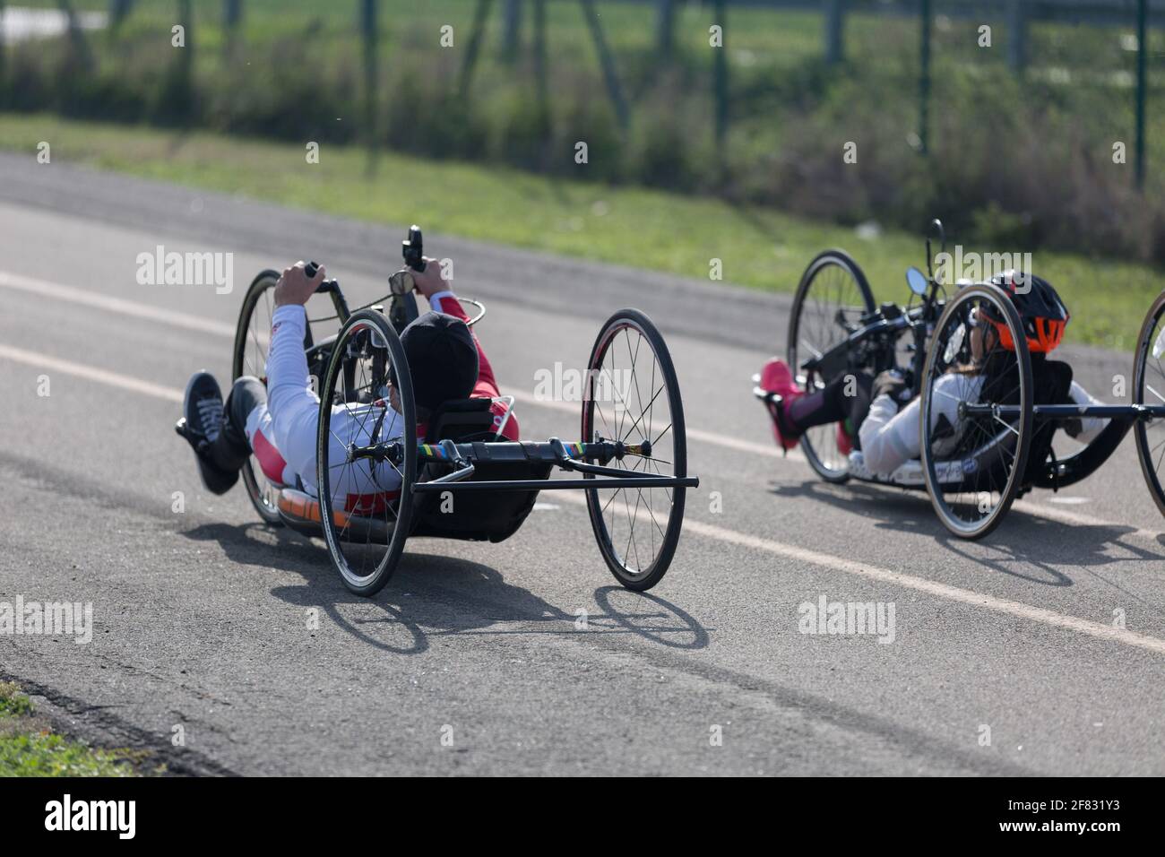 Couple of Disabled Athlete training with Their Hand Bikes on a Track ...