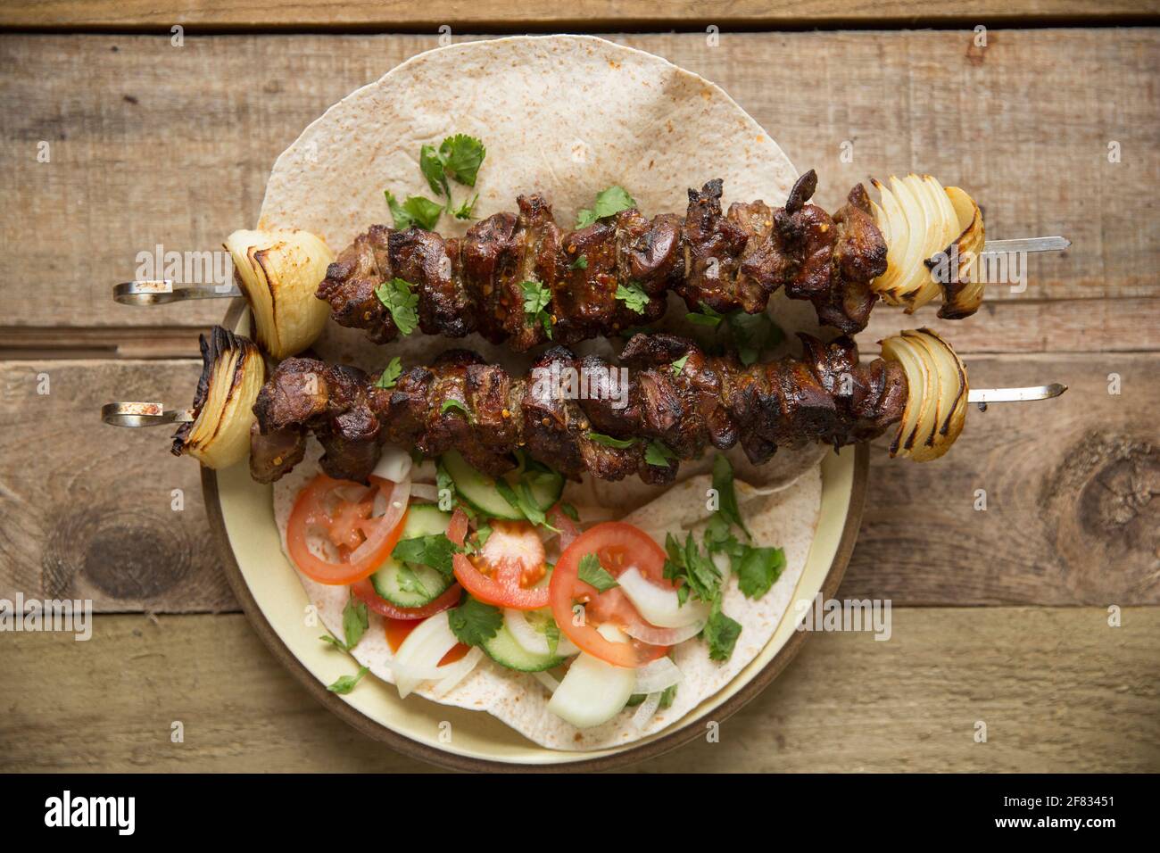 Homemade kebabs of rolled British lamb and British lambs liver that have been marinaded in a Lebanese spice mix and chilli flakes and oil before be Stock Photo