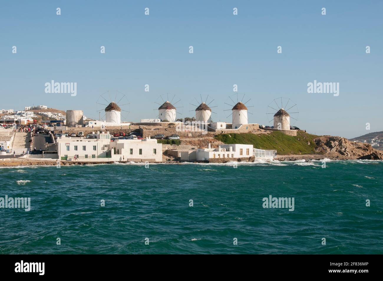Panoramic view from the sea of the windmills on the island of Mykonos in Greece, Cyclades Islands. Tourism travel concept Stock Photo