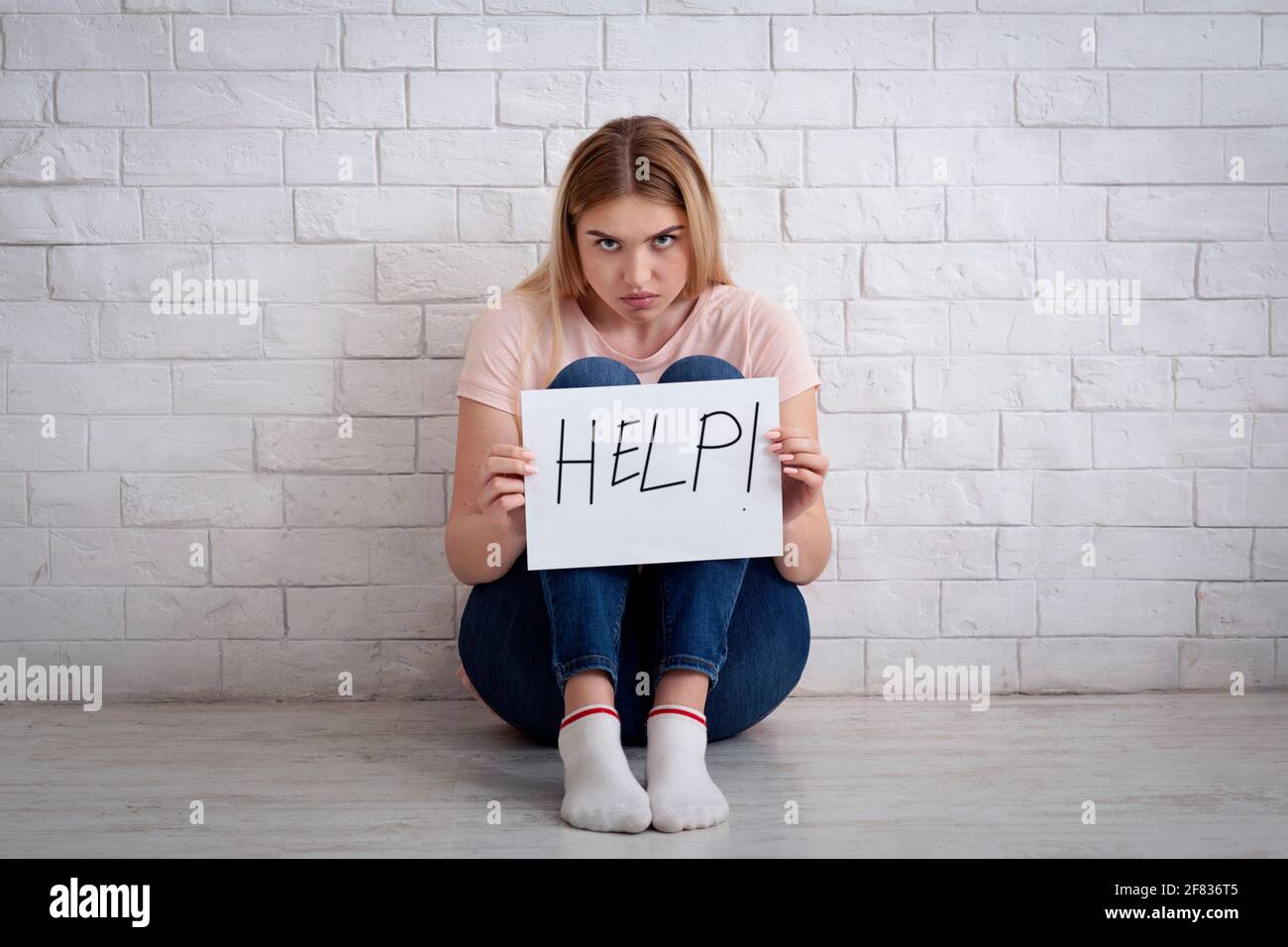 Asking for help, domestic violence and helplessness Stock Photo