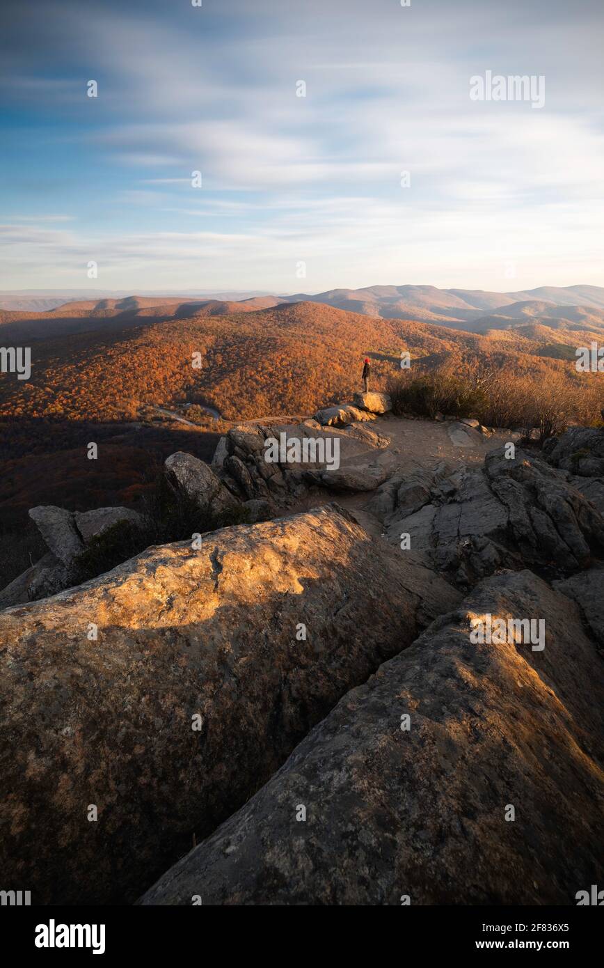 A hiker taking in the sunrise views of Shenandoah National Park during a late Fall day. Stock Photo