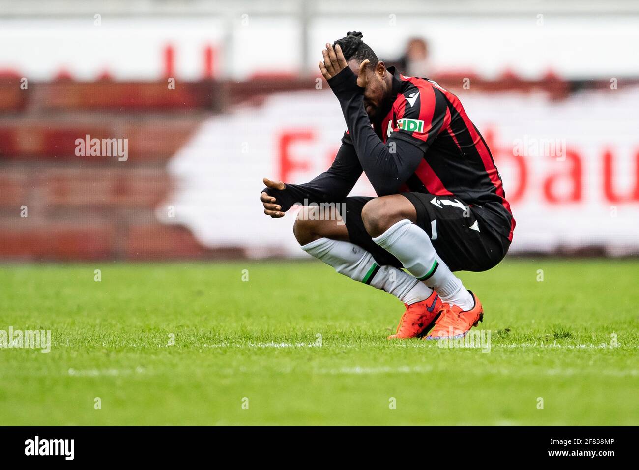 Hanover, Germany. 11th Apr, 2021. Football: 2. Bundesliga, Hannover 96 - 1.  FC Heidenheim, Matchday 28, at the HDI Arena. Hannover's Patrick Twumasi  gestures after the final whistle. Credit: Swen Pförtner/dpa -