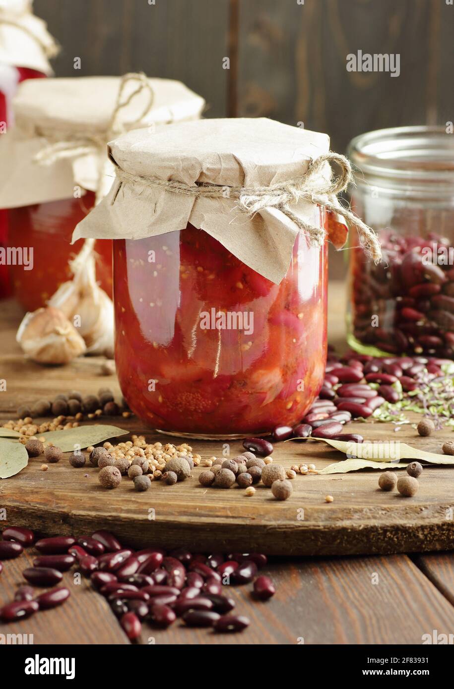 Canned kidney bean in tomato paste in glass plastic free jar on rustic