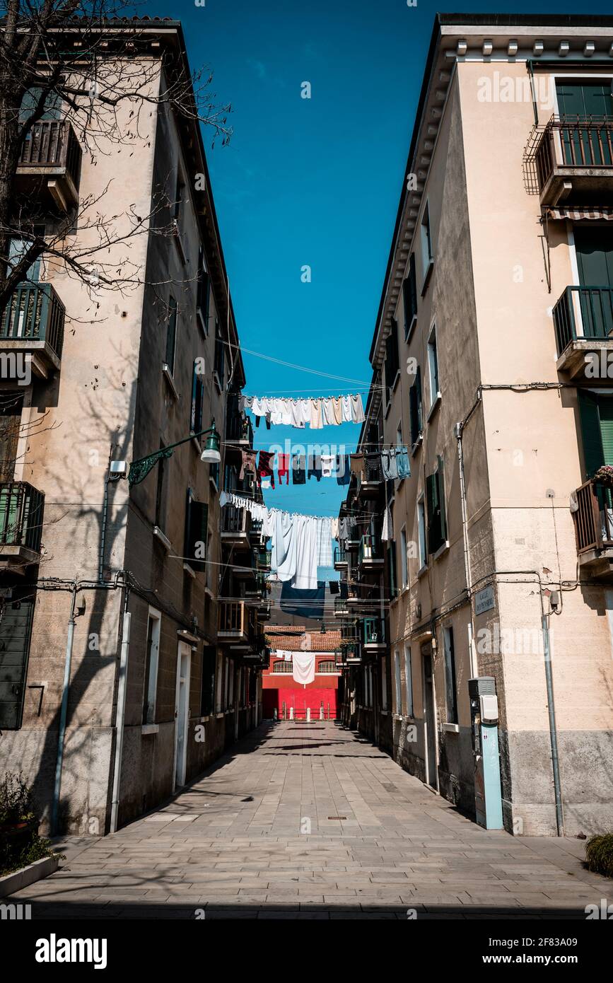 Clothesline between buildings hires stock photography and images Alamy