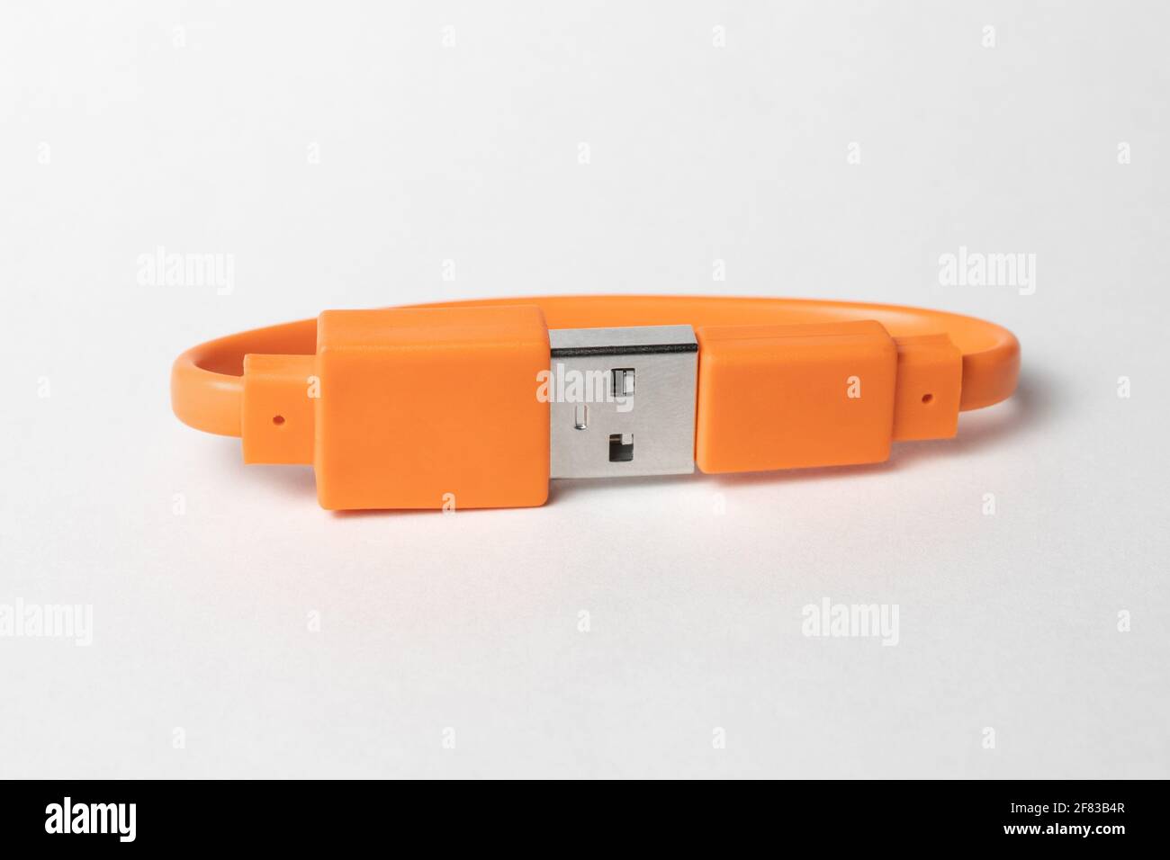 Orange USB cabel isolated on grey background Stock Photo