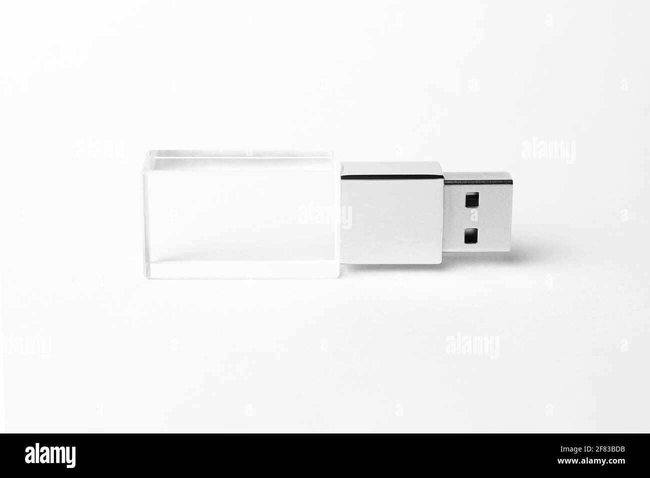 Glass USB flash drive isolated on grey background. Layout. Copy space