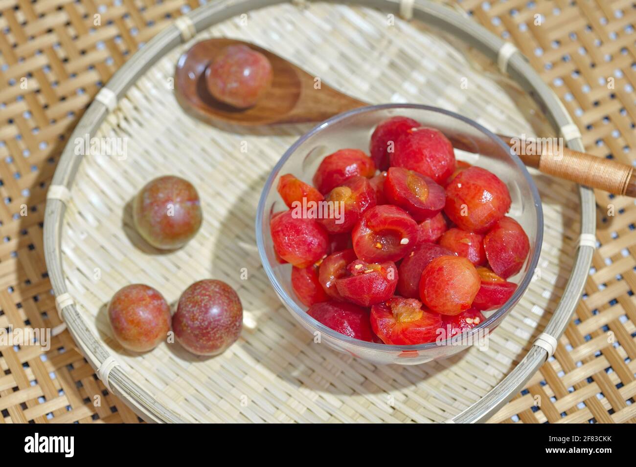 Vietnam plums peeled fruits in glass bowl Stock Photo Alamy