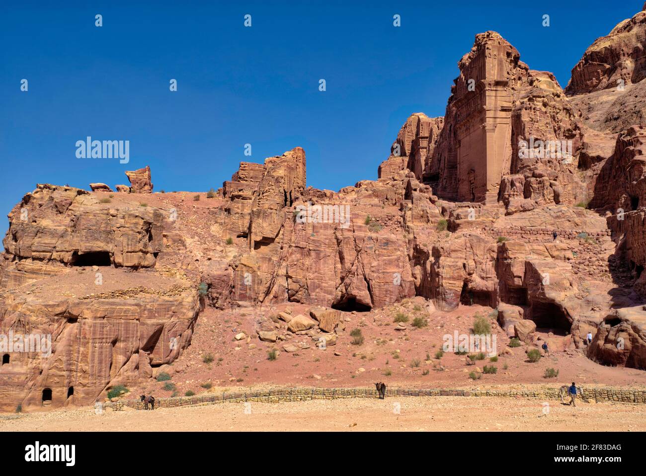 This tomb carved by the Nabateans in the face of Jabal al-Khubtha, the mountain overlooking Petra on the East and is dedicated to a member of the Naba Stock Photo