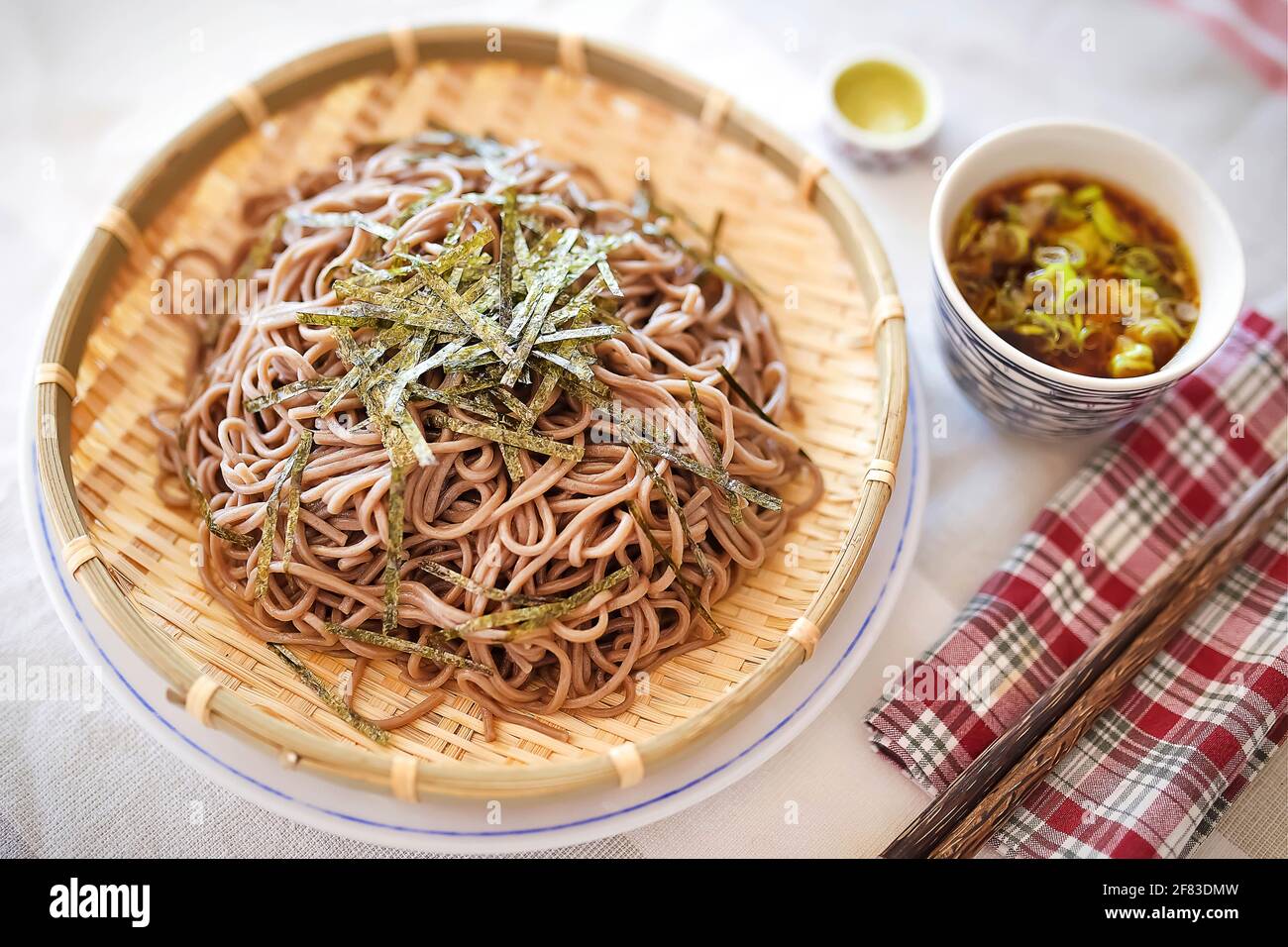 Soba noodles on bamboo tray, use with featured soy sauce Stock Photo