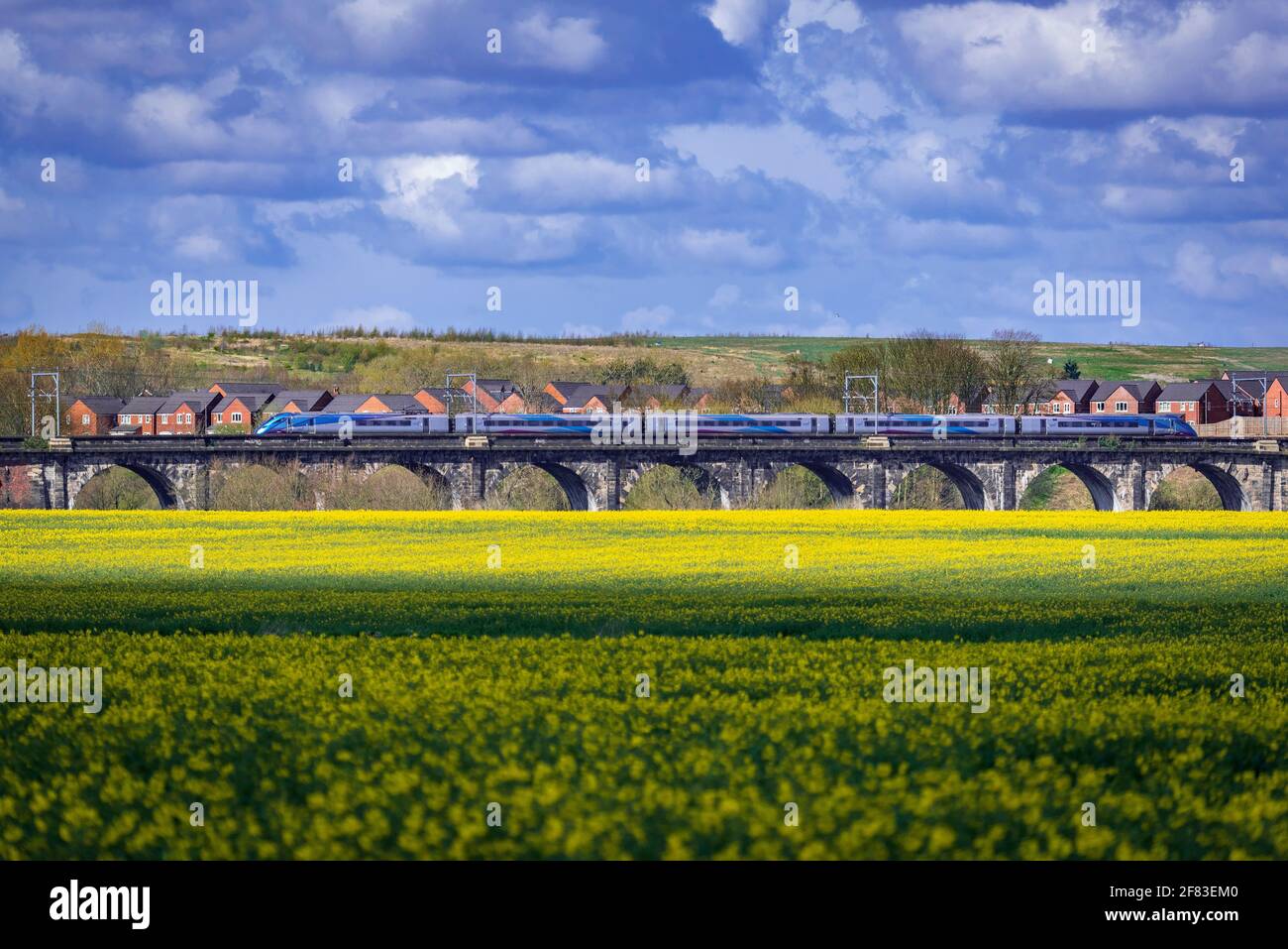 The Sankey Valley viaduct, the first railway viaduct in the world. Trans Pennine express train. Hitachi Class 800 Azuma heading west. Stock Photo