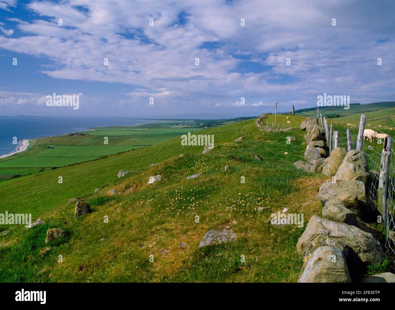 Beacharra (Beacharr) standing stone, Kintyre, Scotland, UK, looking N along the ridge overlooking the Sound of Gigha & a raised beach at Killean (L). Stock Photo