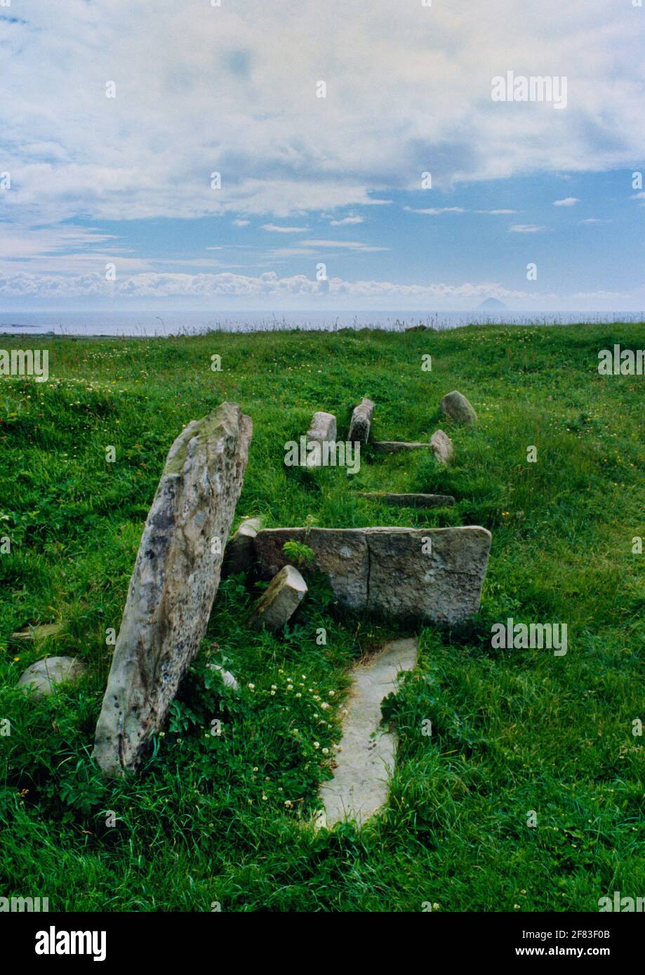 View SSE of the robbed long cairn & exposed burial compartments of Torrylin Neolithic chambered tomb, Arran, Scotland, UK: a Clyde-type gallery grave. Stock Photo