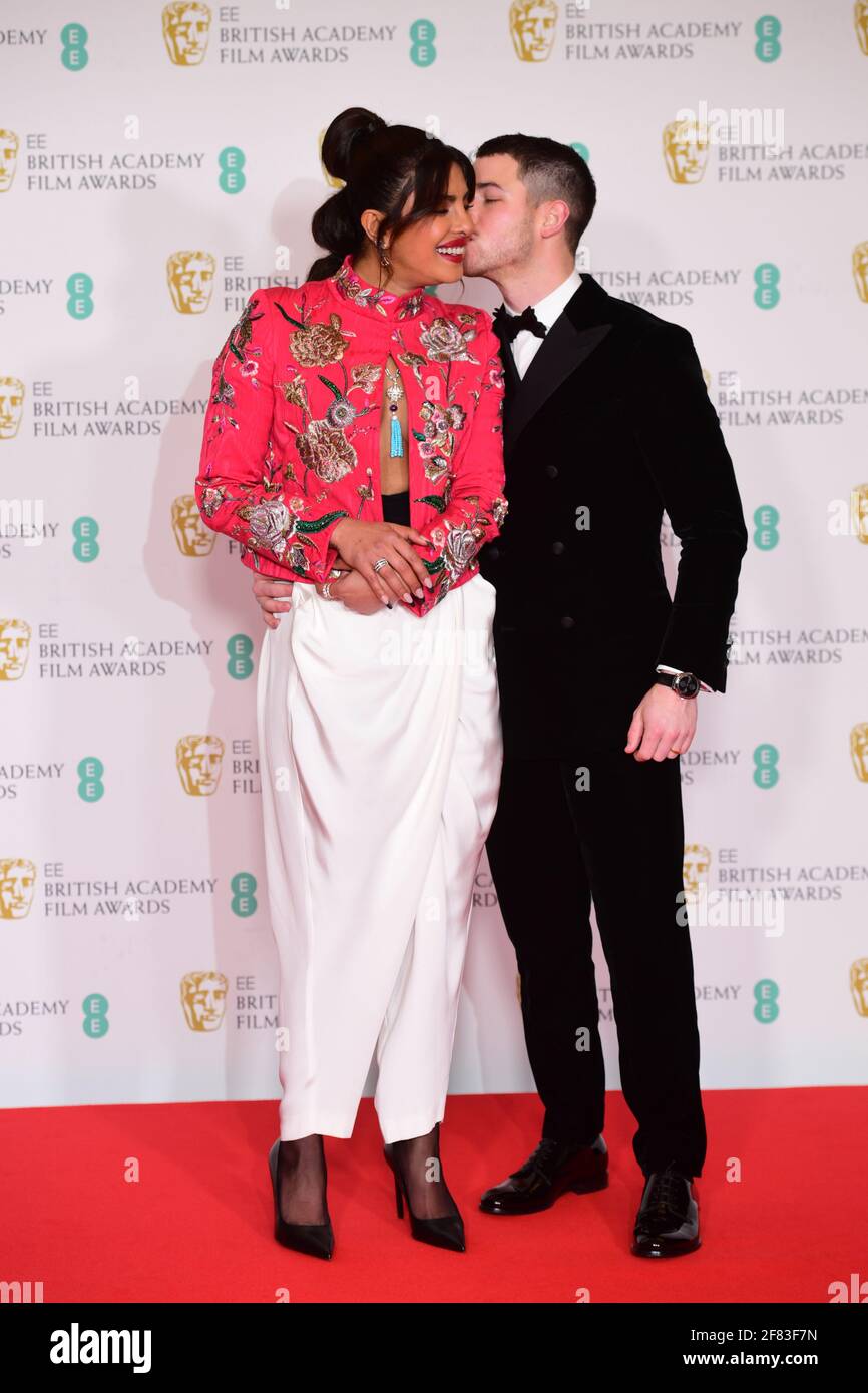 Priyanka Chopra Jonas and her husband Nick Jonas arrives for the EE BAFTA Film Awards at the Royal Albert Hall in London. Picture date: Sunday April 11, 2021. Stock Photo