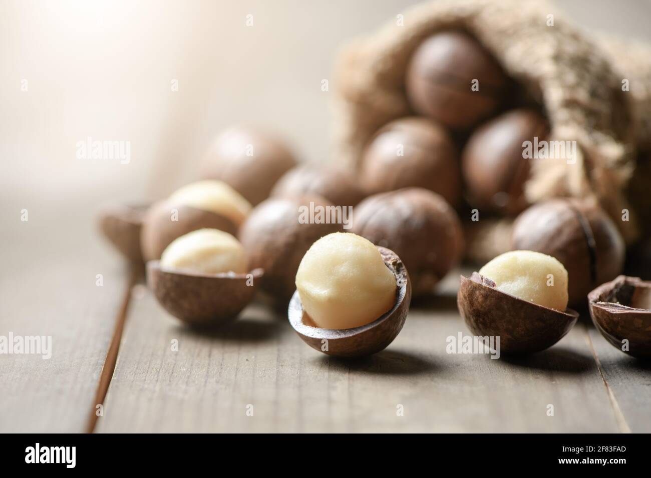 Peeled macadamia nuts on wood background, Macadamia nuts are loaded