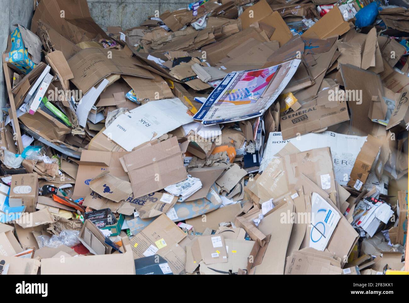 Old cardboard boxes and packaging at a recycling facility Stock Photo