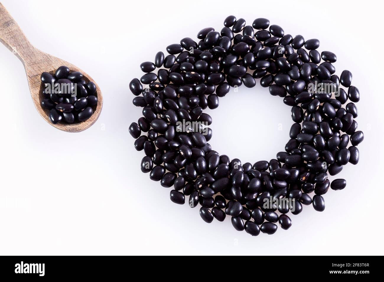 Raw black bean white background Stock Photo Alamy