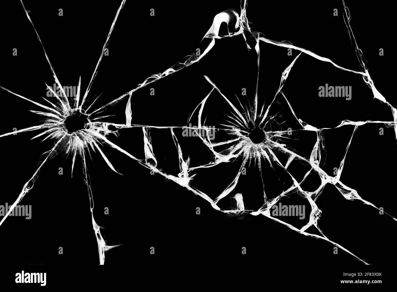 Shot glass with cracks, texture of cracked damaged car windshield. Stock Photo