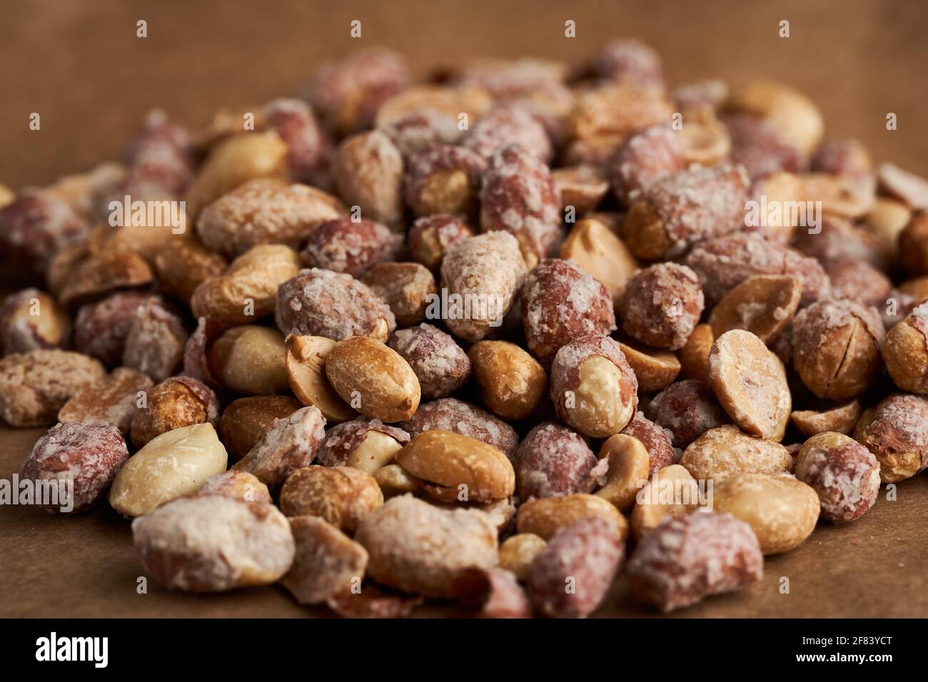 Oven baked peanuts in skin, heavily salted Stock Photo Alamy