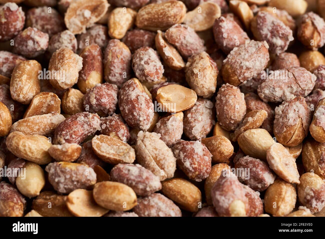 Oven baked peanuts in skin, heavily salted Stock Photo Alamy