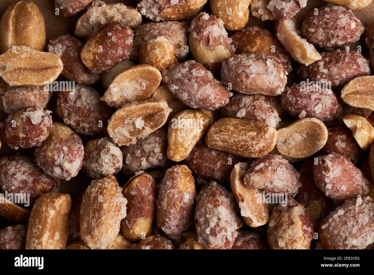 Oven baked peanuts in skin, heavily salted Stock Photo Alamy