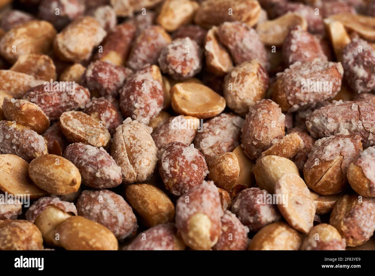 Oven baked peanuts in skin, heavily salted Stock Photo Alamy