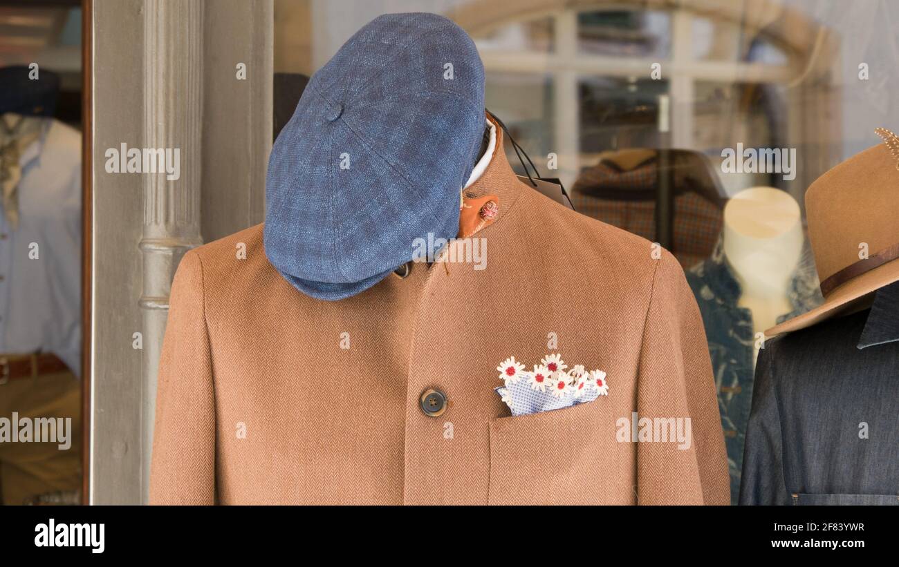 Showroom with men's jacket and blue hat Stock Photo