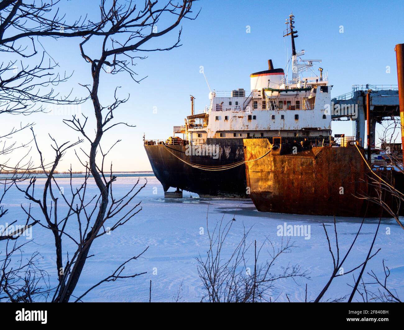 abandoned boat parked on the shore on a sunset Stock Photo - Alamy