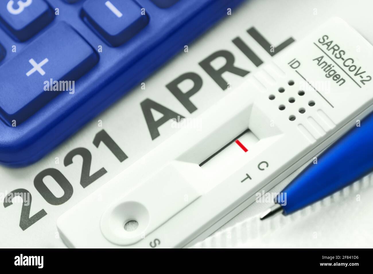 Corona Antigen Rapid Test and calculator Stock Photo