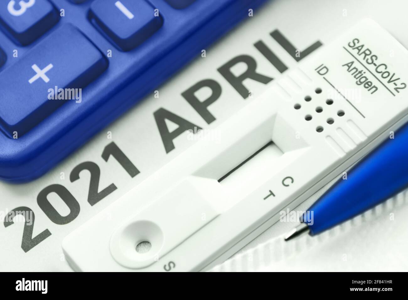 Corona Antigen Rapid Test and calculator Stock Photo