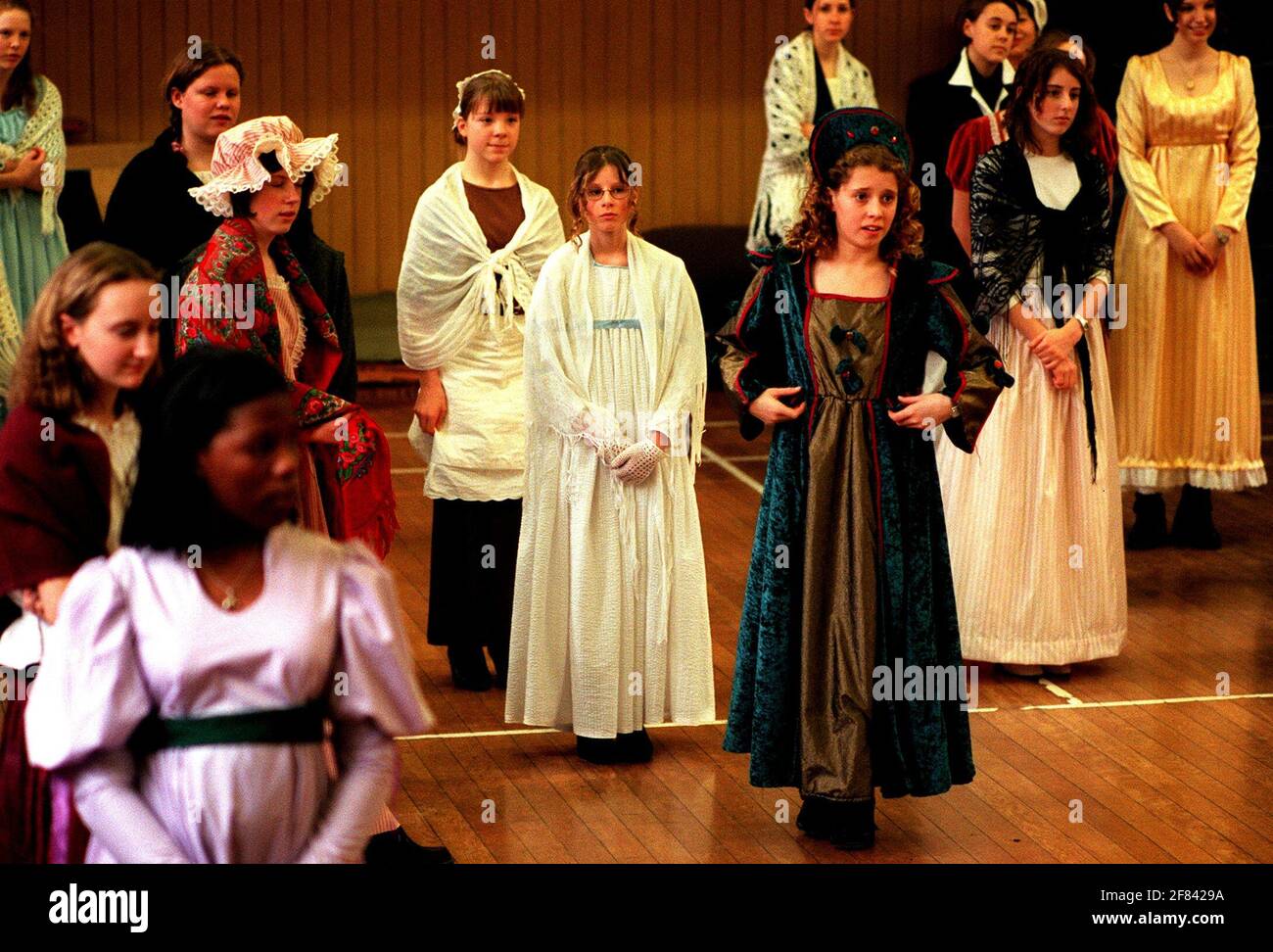 Pupils at New Hall School Chelmsford January 1999 New Hall School Chelmsford ( a Catholic girls school) is 357 years old this year  marks the 200 anniversary of the school at it's present site and to mark this the pupils and staff dressed in  costumes that would have been worn at the time and had lessons along the same theme  In the picture some of the girls are learning to dance to a minuet dressed as 19th century pupils Stock Photo