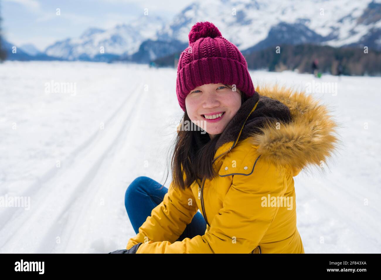 Winter holidays in the snow lifestyle portrait of young happy and