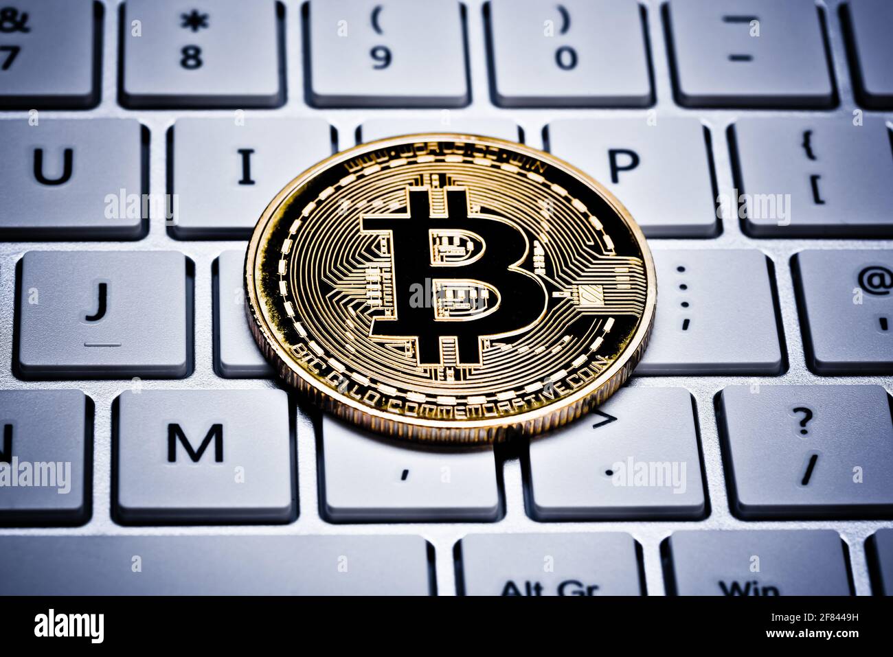 Bitcoins on keyboard, mining with computer, digital ledger as security  wallet, bitcoin is the virtual currency Stock Photo - Alamy