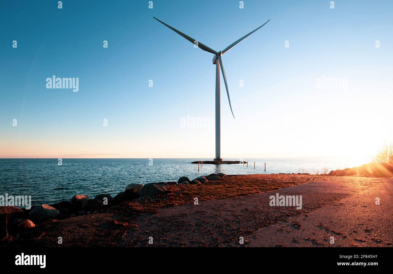 Wind power generation in Denmark near sunset Stock Photo