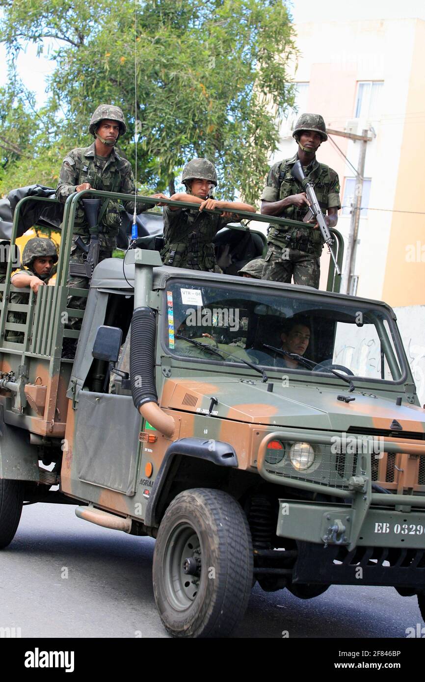 salvador, bahia / brazil  - april 23, 2014: Army military patrols in Salvador's Sussuarana neighborhood during military police strike. *** Local Capti Stock Photo