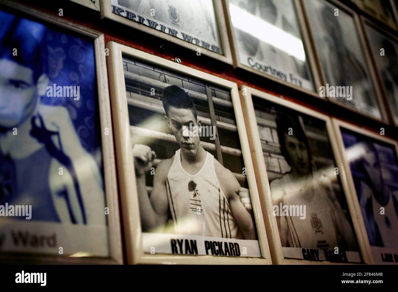 Historic boxing photos in frames on a wall. Stock Photo