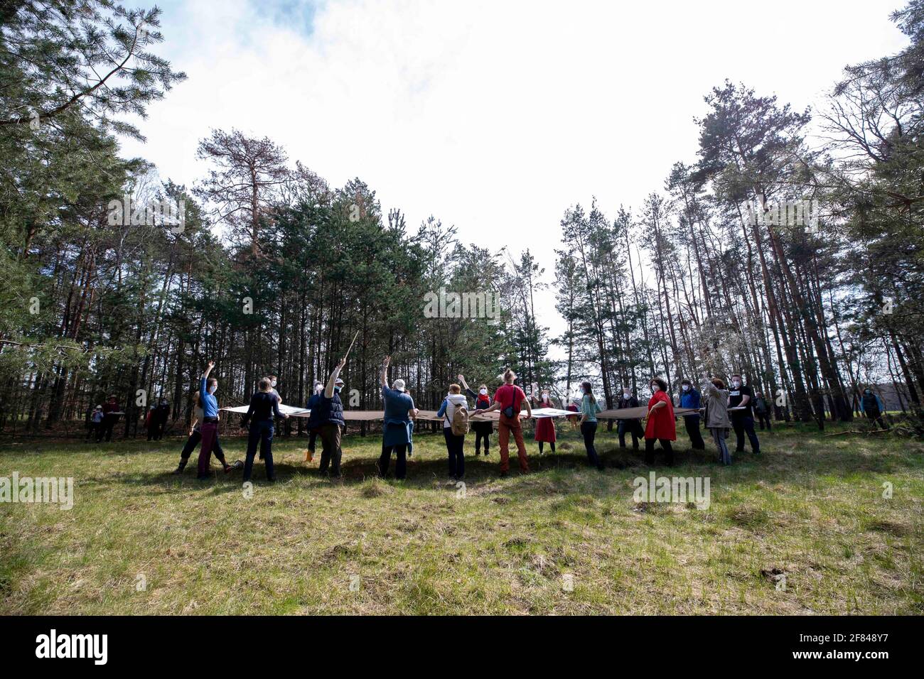 Schleife, Germany. 11th Apr, 2021. A banner with the inscription 'UNVERKÄUFLICH www.kein-tagebau.de' is set up in the forest near Schleife. The protest action 'Unverkäuflich' of the environmental network Grüne Liga in Schleife near the opencast mine Nochten in the district of Görlitz is directed against the threatening dredging by LEAG (Lausitz Energie Bergbau AG). Credit: Daniel Schäfer/dpa-Zentralbild/dpa/Alamy Live News Stock Photo