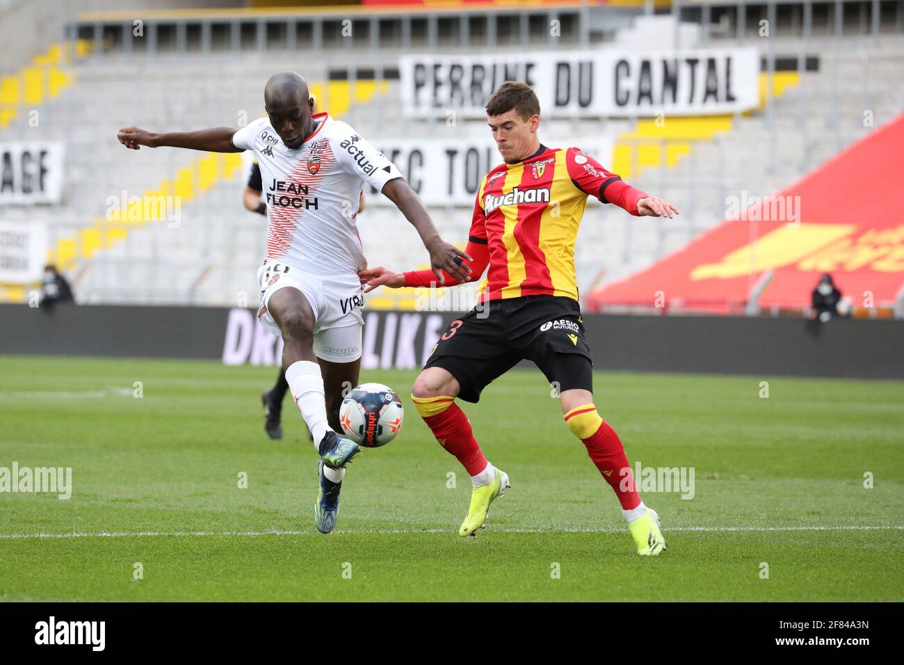 Lens, France. 11th Apr, 2021. Duel Yoane Wissa 19 Lorient and Clément  Michelin 13 RC Lens during the French championship Ligue 1 football match  between RC Lens and FC Lorient on April