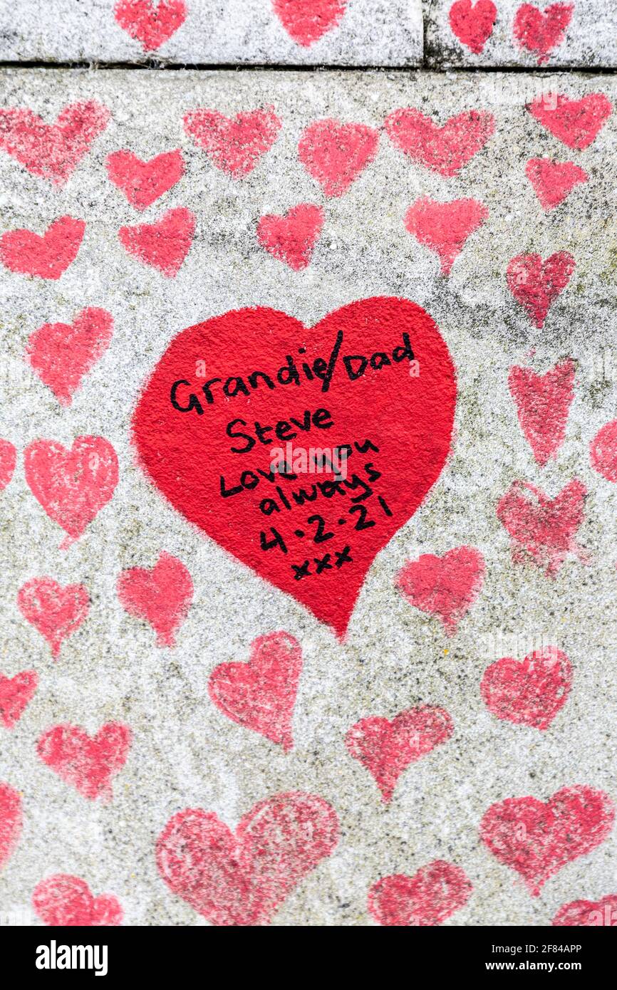 11 April 2021, London, UK - Hearts drawn on the The National COVID Memorial Wall along the South Bank as tribute to those who died during the coronavirus pandemic Stock Photo