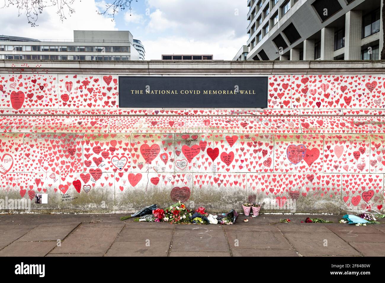 11 April 2021, London, UK - Hearts drawn on the The National COVID Memorial Wall along the South Bank as tribute to those who died during the coronavirus pandemic Stock Photo