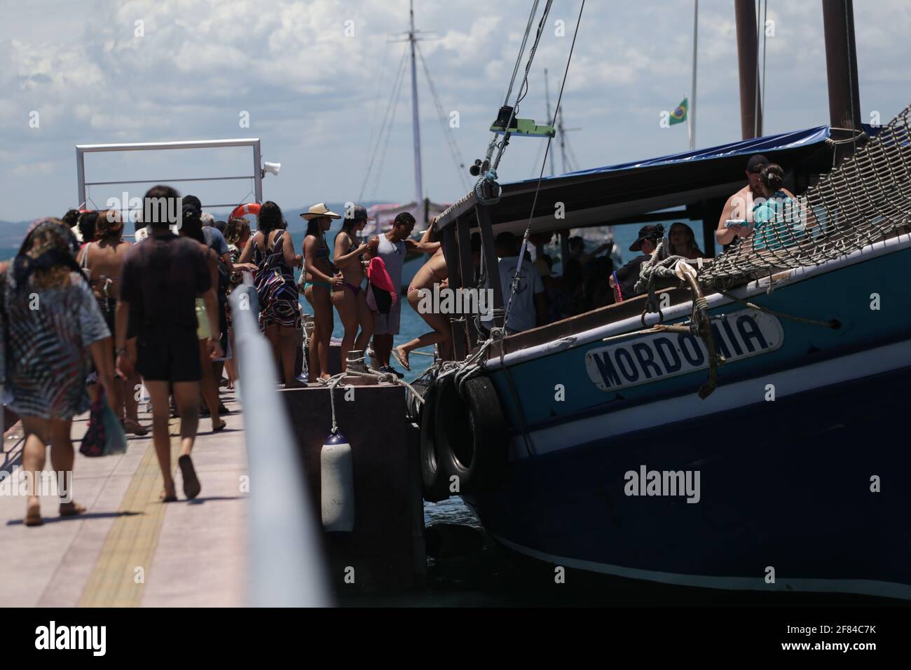 salvador, bahia / brazil  - january 31, 2019: Passengers are seen at the pier of Ilha dos Frades schooning for schooner for a nautical ride through th Stock Photo