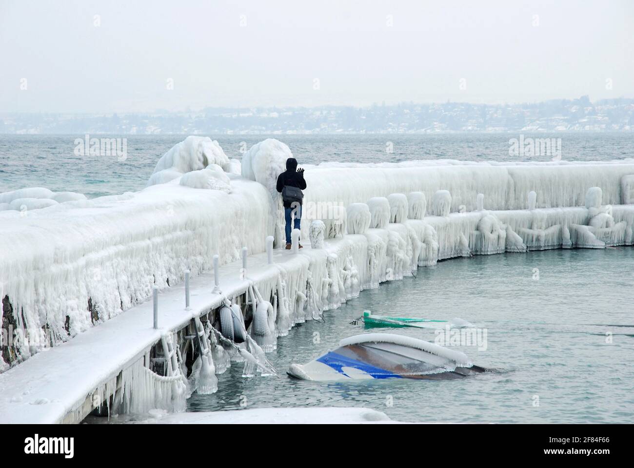 Iced pier, ice layer, ice shield, Lake Geneva, Versoix, Canton Geneva, Switzerland Stock Photo