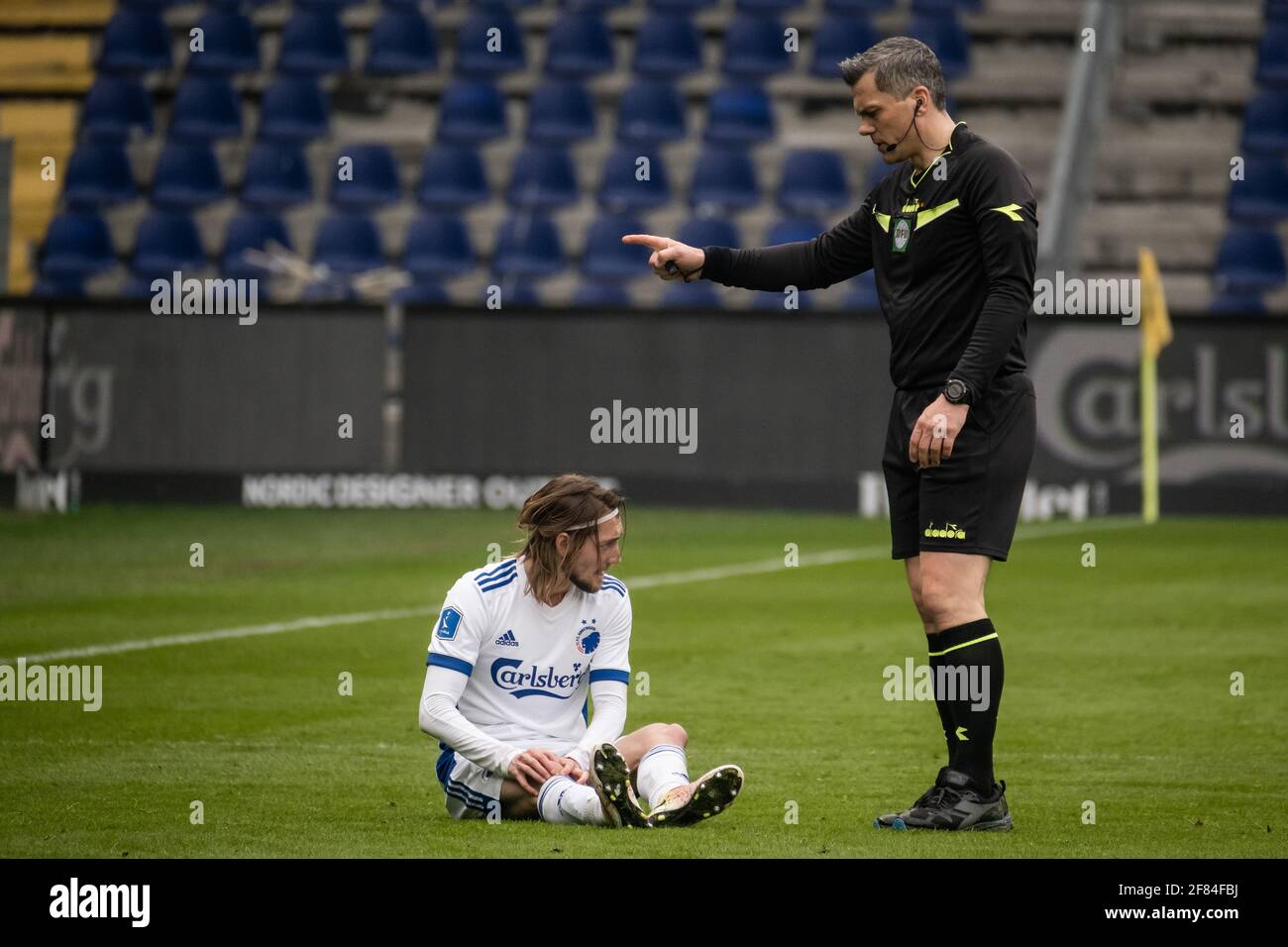 Brondby, Denmark. Apr, Rasmus Falk (33) of FC Copenhagen seen with referee Michael Tykgaard standing beside him during the 3F match between Brondby IF and FC Copenhagen at Brondby