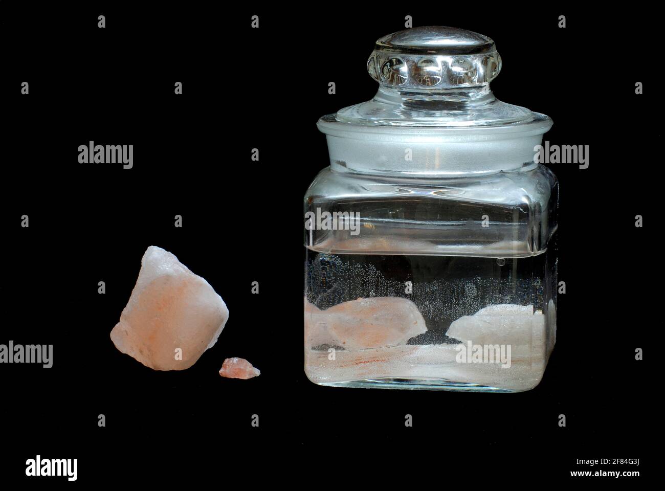 Saturated salt solution in glass container, brine, saltwater solution