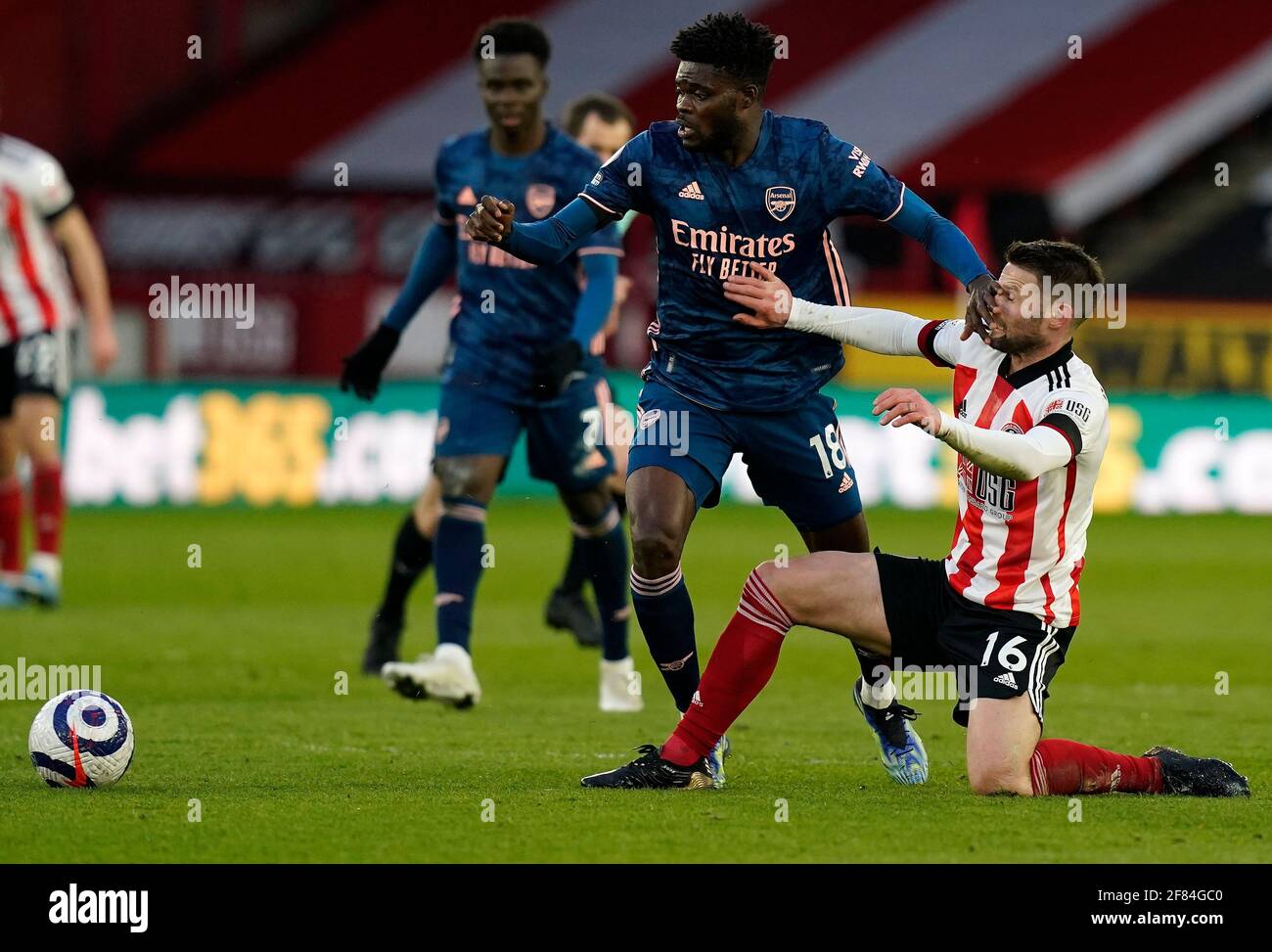 Sheffield, UK. 11th Apr, 2021. Oliver Norwood of Sheffield Utd tussles with Thomas Partey of Arsenal during the Premier League match at Bramall Lane, Sheffield. Picture credit should read: Andrew Yates/Sportimage Credit: Sportimage/Alamy Live News Stock Photo