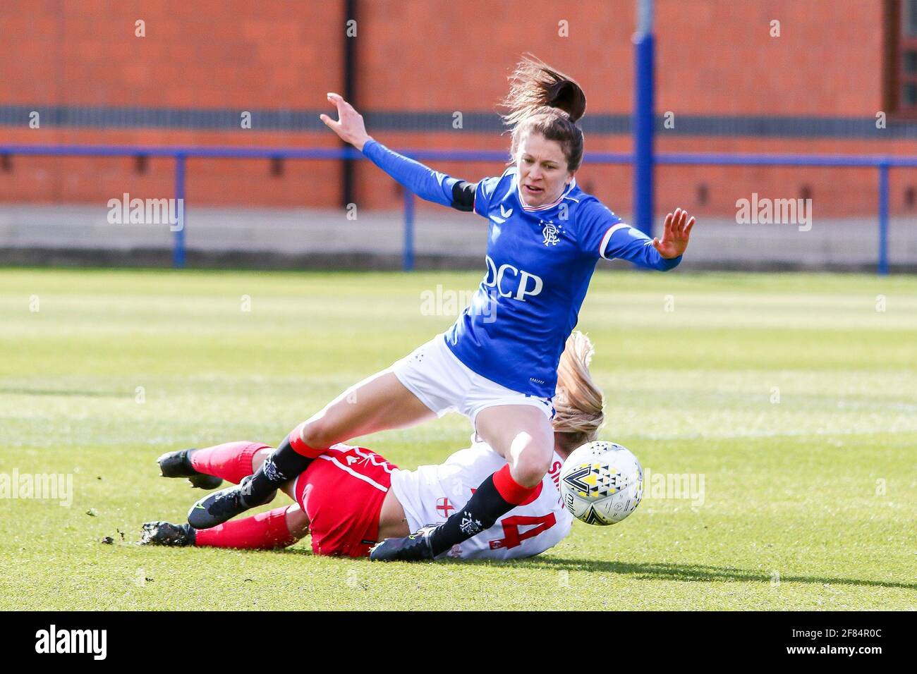 Glasgow, UK. 11th Apr, 2021. Lizzie Arnot (#15) of Rangers Women FC & Kat Smart (#24) of Spartans FC Women collide during the Scottish Building Society SWPL1 Fixture Rangers FC vs Spartans FC at Rangers Training Centre, Glasgow, 11/04/2021 | Images courtesy of www.collargeimages.co.uk Credit: Colin Poultney/Alamy Live News Stock Photo