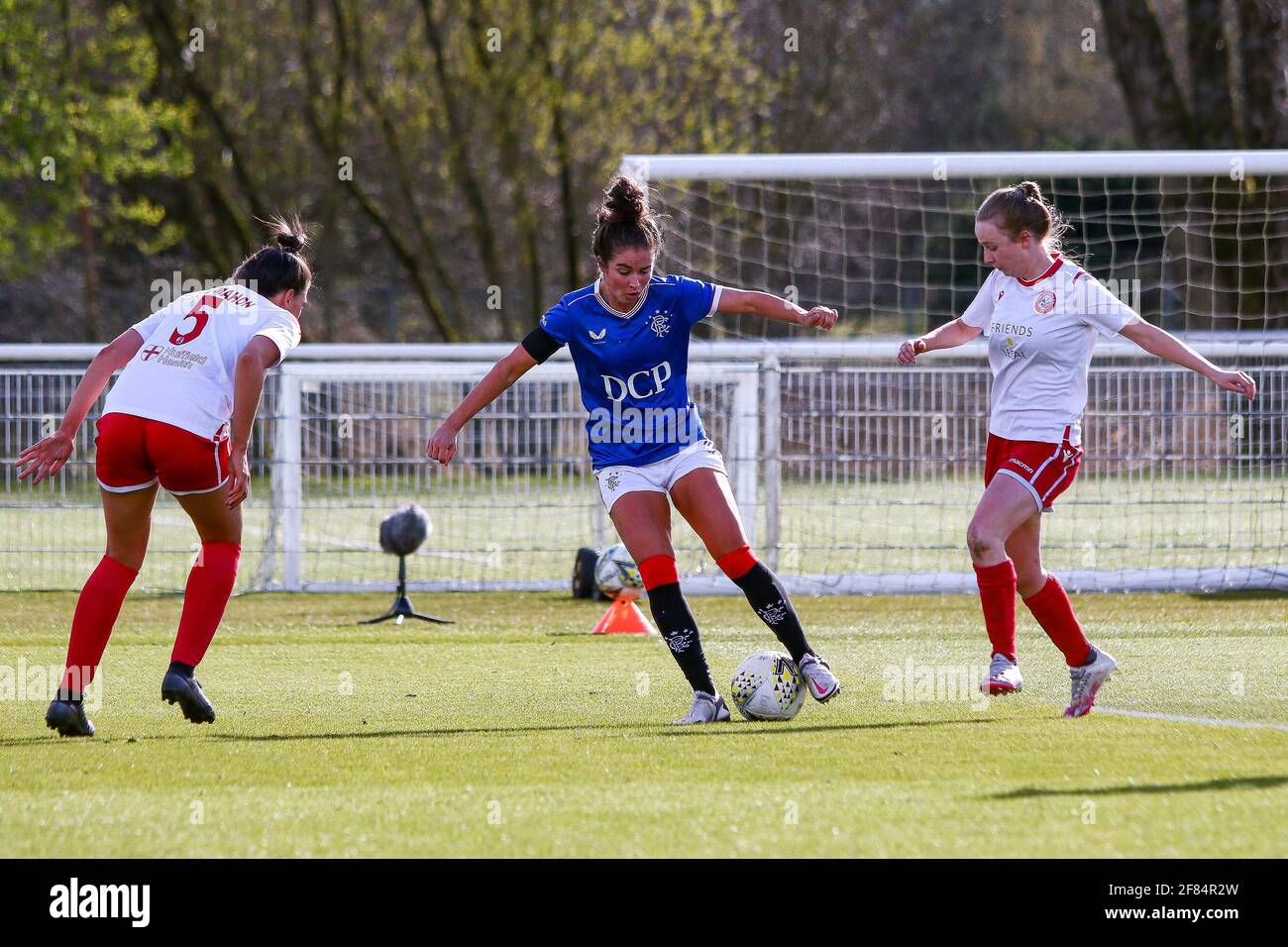 Glasgow, UK. 11th Apr, 2021. Emma Brownlie (#4) of Rangers Women FC beats 2 defenders during the Scottish Building Society SWPL1 Fixture Rangers FC vs Spartans FC at Rangers Training Centre, Glasgow, 11/04/2021 | Images courtesy of www.collargeimages.co.uk Credit: Colin Poultney/Alamy Live News Stock Photo
